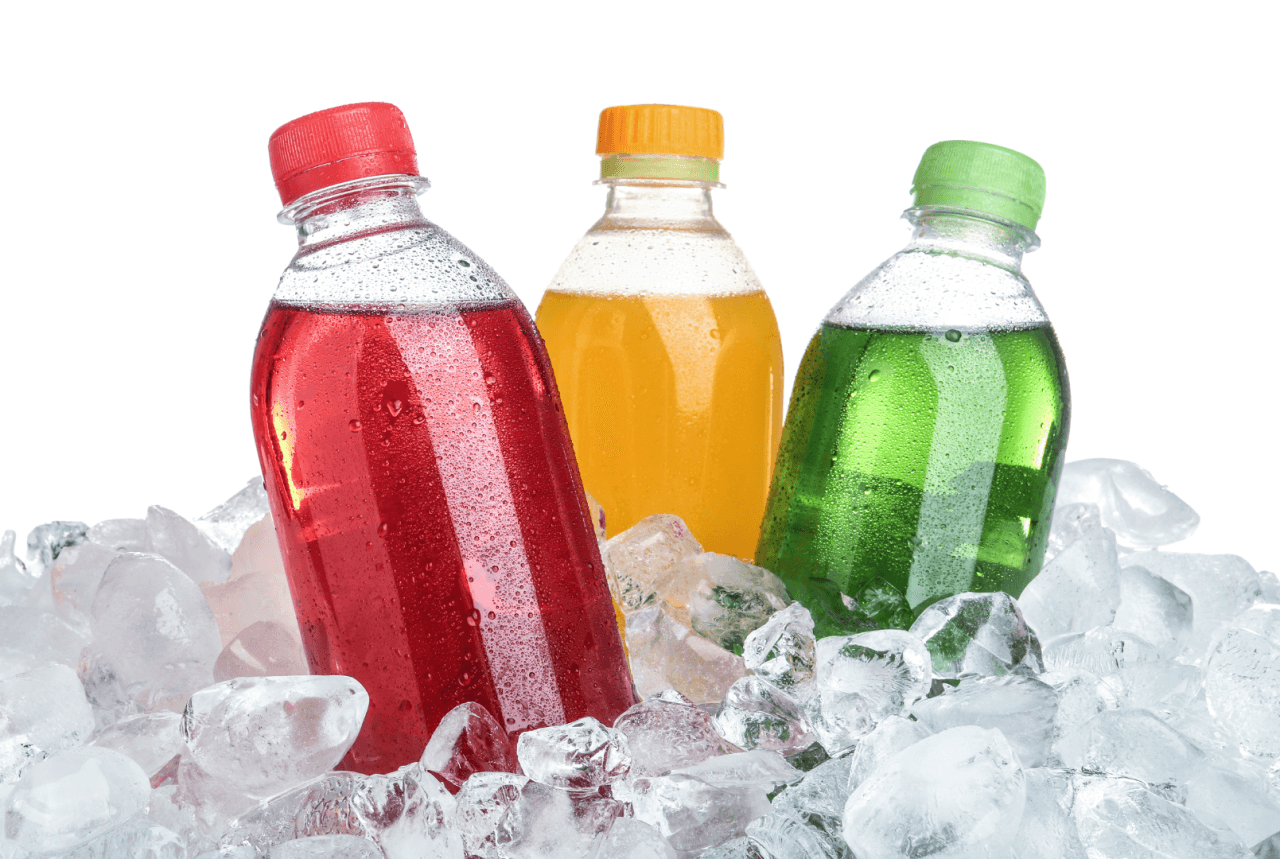 three bottles of colorful beverage