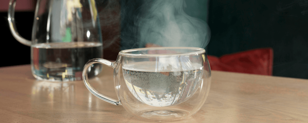 a cup of hot, smoking water