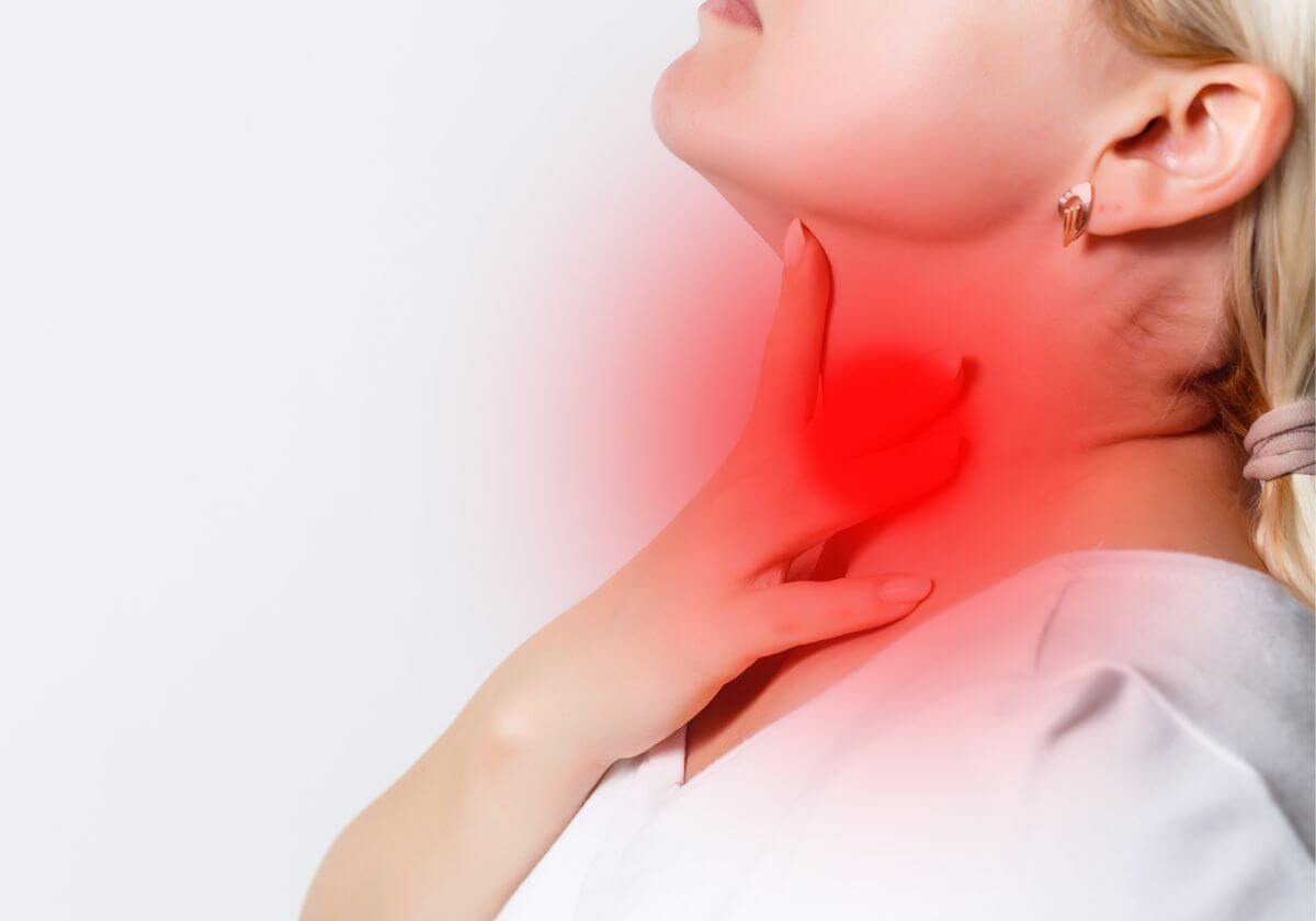 woman suffering from sore throat