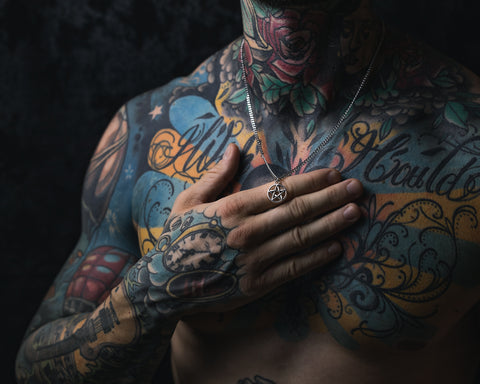 tattooed model with unisex pentagram necklace