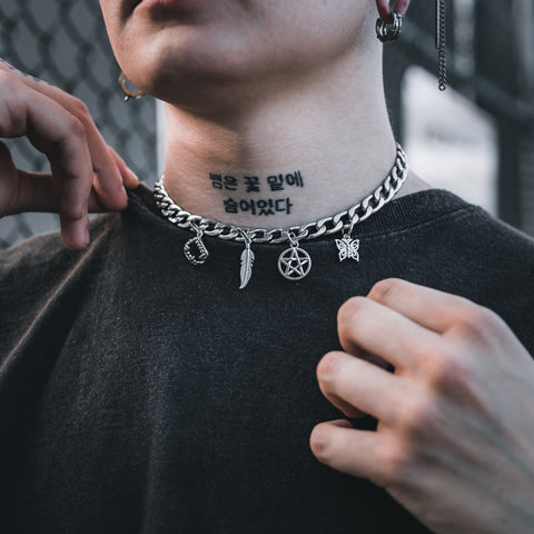 tattooed model with gothic cuban link choker necklace