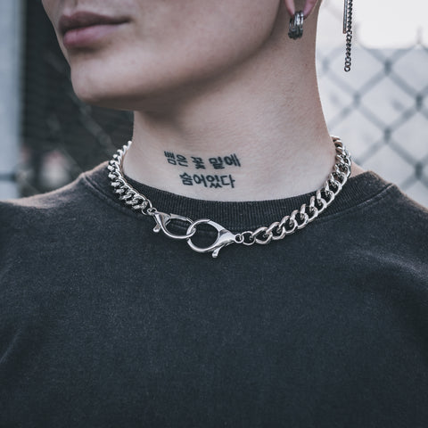 model wearing choker necklace with handcuff like clasps