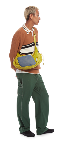model sporting the Crescent Crossbody in the color Citronelle