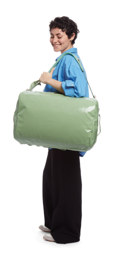 model sporting the Go-Bag — Small in the color Mineral Green