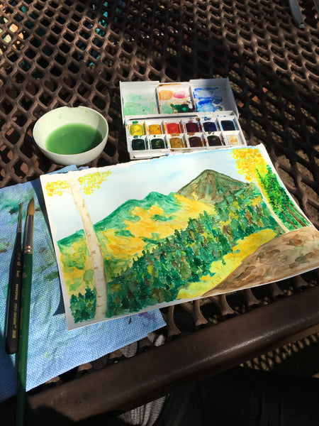 Watercolor painting of the fall leaves covering the mountain, yellow, red, green