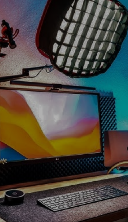 Person video conferencing with another person on a computer screen, with a light setup behind.