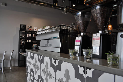 An espresso machine inside the cafe at Copper Door Coffee, a Denver coffee roaster