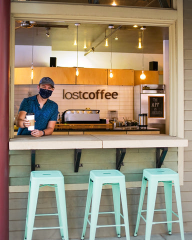 Lost coffee barista handing out a cup of coffee