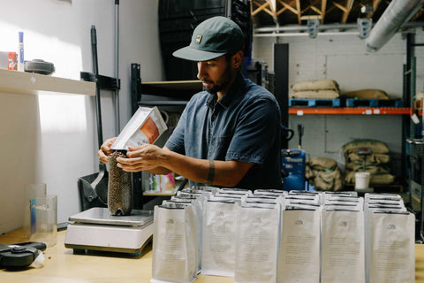 Bagging coffee a Middle State Coffee, a Denver coffee roaster