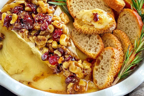 taylor pass honey baked brie topped with bread cranberries walnuts