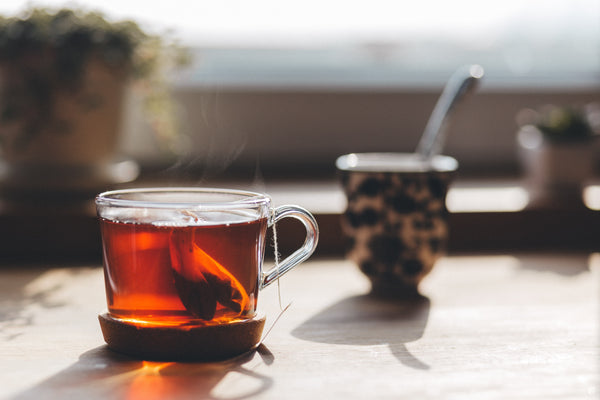 tea bags steeping in hot tea cup