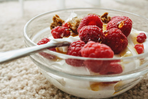 yogurt bowl with honey raspberries granola parfait