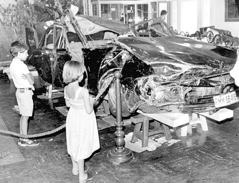 Children look at Luis Carrero's Blanco destroyed Dodge 3700 GT on display at the Army Museum in Spain.