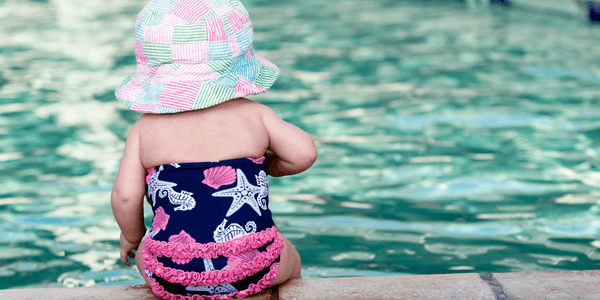 baby enjoying winter sun at pool