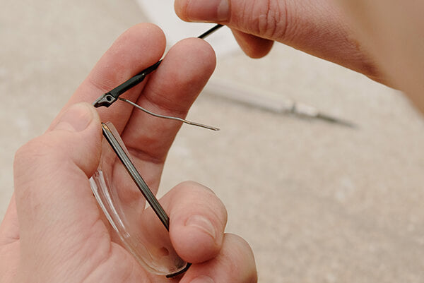 Repairing glasses with a screwdriver