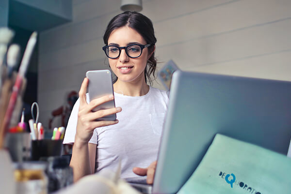 A woman looking at the phone