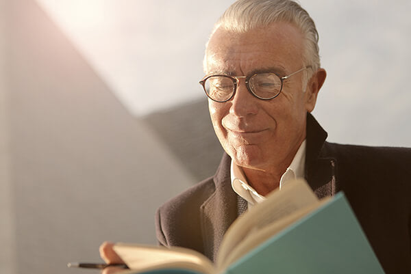 An old grandpa is reading