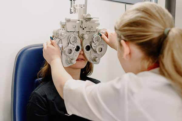 The optometrist is opting the customer