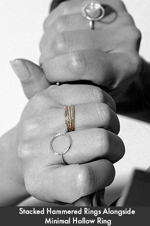 Featuring Neatly Stacked Gold & Silver Hammered Rings alongside Minimal Hollow Silver Ring