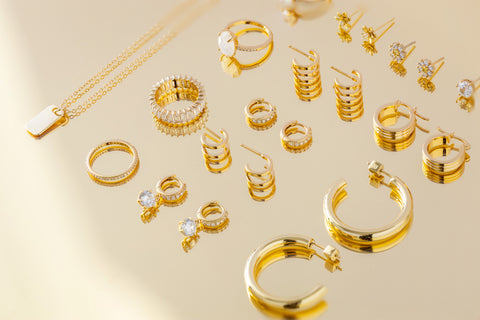 gold jewelry on a reflective background