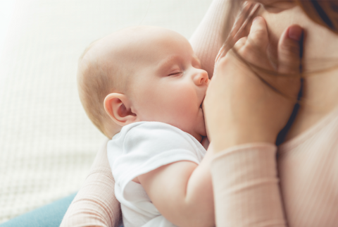 Woman Breastfeeding Her Child