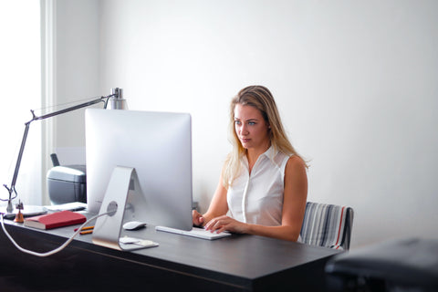Woman at Desktop in Neutral Sitting Position might because computer elbow