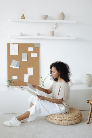 Bulletin board and woman in minimalist home office