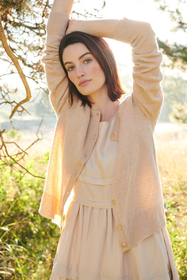 Erin wears the Willow Cardigan and Lantern Dress in Caramel.