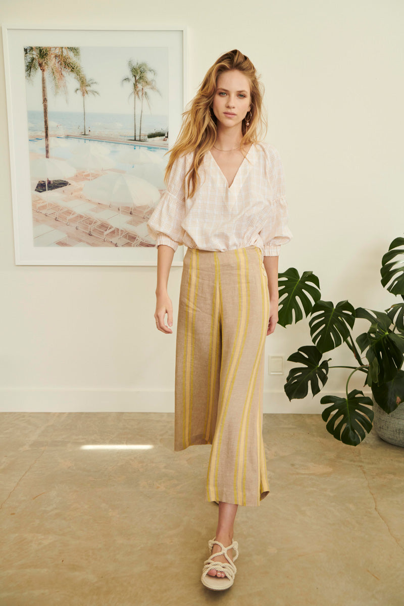 Serena wears the Plaza V Neck Top with the Bayside Pants.