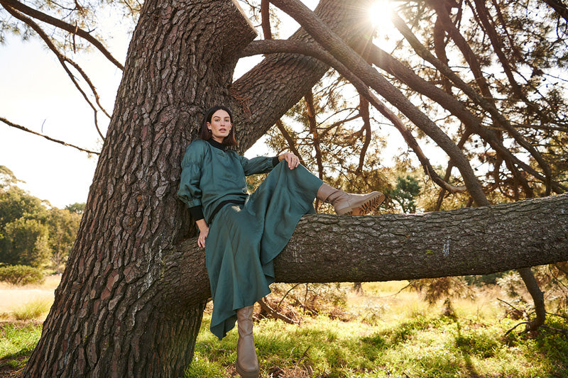 Erin wears the Cypress Top and Cypress Skirt in Forest.