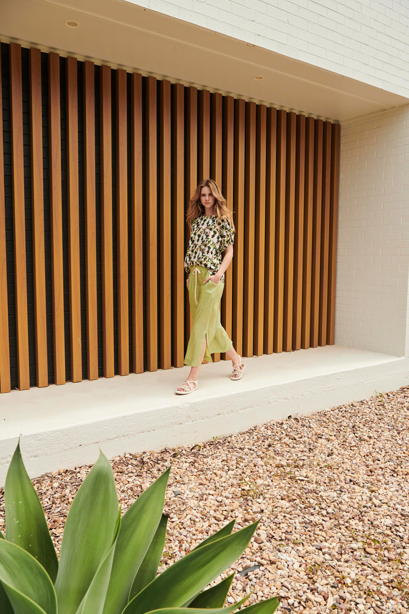 Serena wears the Clementine Top with the Sicily Pant in Pistachio.