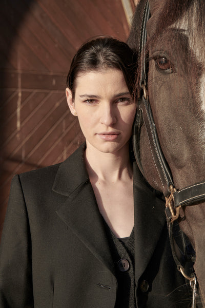 Madi wears the Dressage Jacket in Black with the Tulle Skirt in Black.