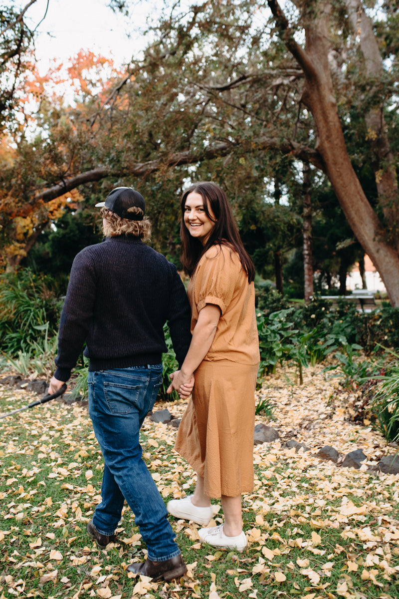 Anna wears the Renata Top and Skirt in Toffee.