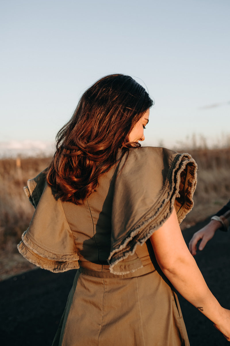 Cristina wears the Fringe Dress in Khaki.