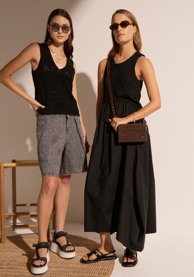 Megumi wears the Maui Pointelle Tank in Black with the Isla Short, and Esti wears the Toya Tank Dress in Black.