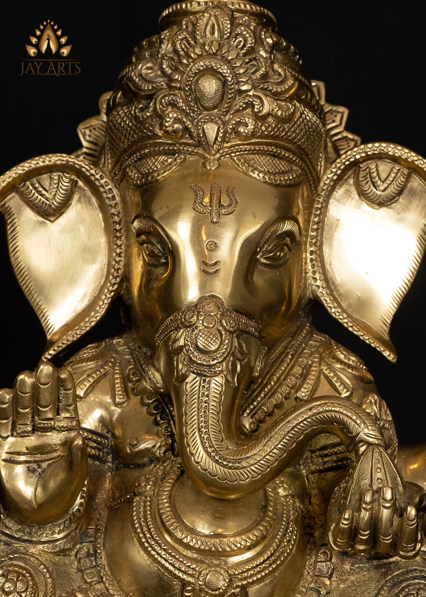 Ashirvadh Ganesh seated on a Pedestal Engraved with Figurines of Baby –  