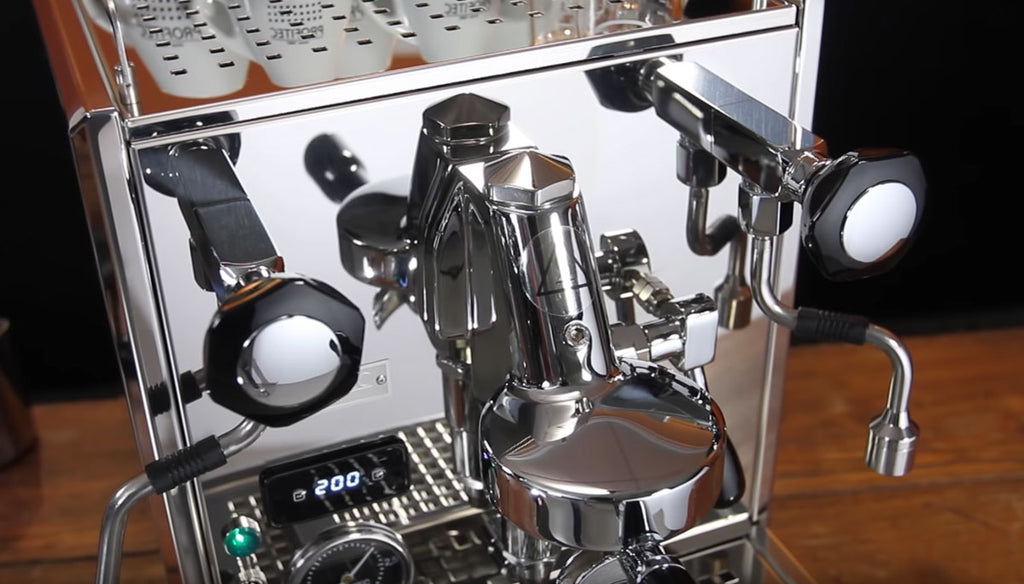 Close up shot of the stainless steel Profitec Pro 700 and its new ergonomic valves and mushroom style group head. 