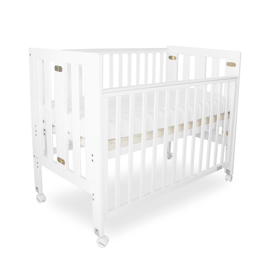 white and timber cot