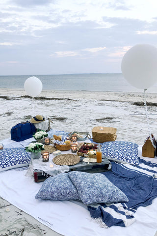 Beach picnic with blue pillows