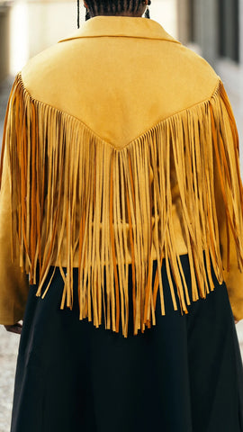back view of the fall fringe suede jacket showing the fringe along the back
