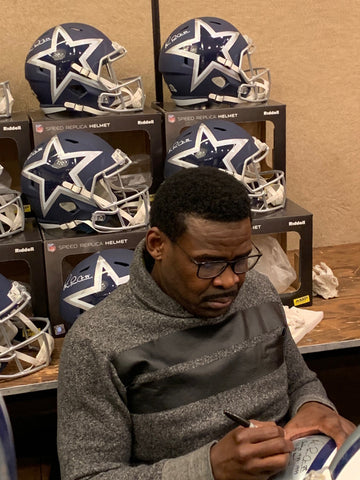 Michael Irvin signing full size Amp helmets