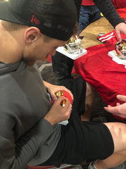 George Kittle signing mini helmet