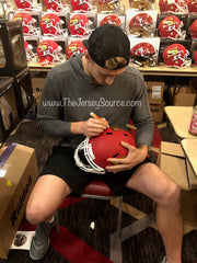 George Kittle signing Amp helmet