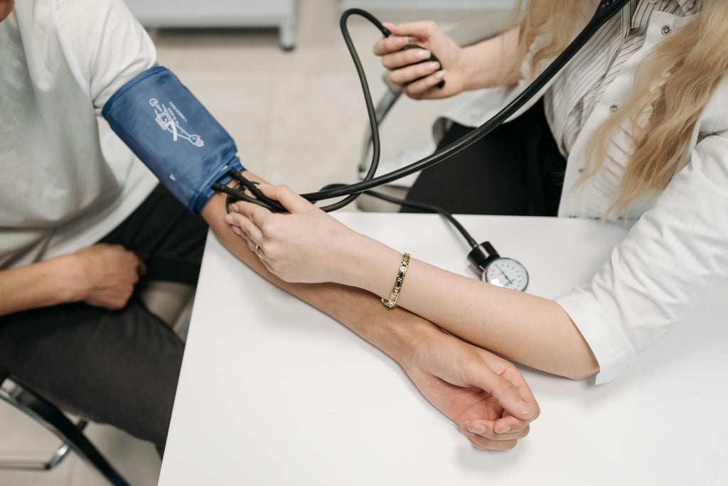 medical professional performing a blood pressure test