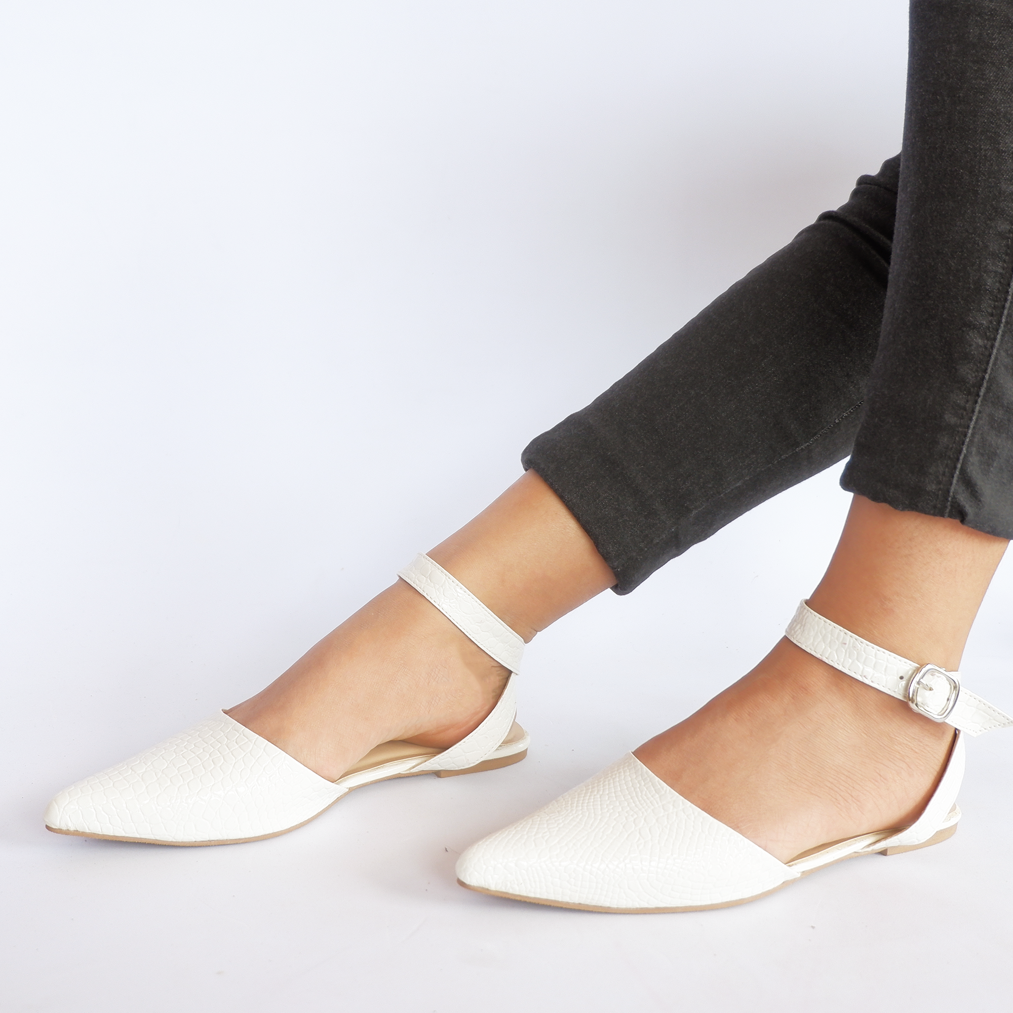 white pointed flats