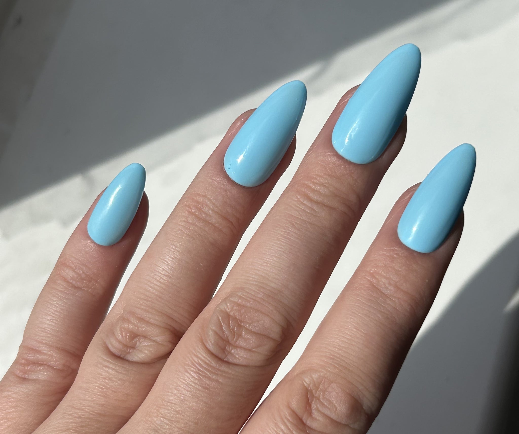Long, almond blue nail look using Halo Gel Polish RIPTIDE Michaela.jpeg__PID:6950ffca-ceed-4247-b0bf-d9baf63cfa1b
