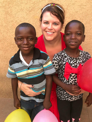 moon and lola kelly shatat with children and ballons in togo africa