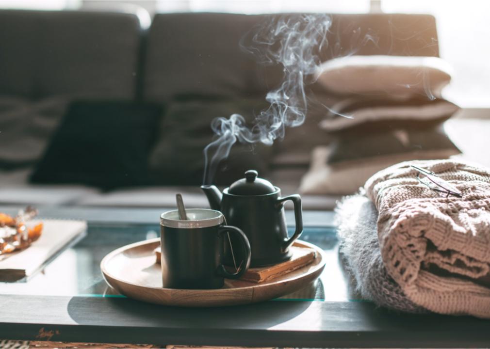 Tea pot steaming. Hot tea. Warm cup of tea. Tea in the winter. Hot drinks. 