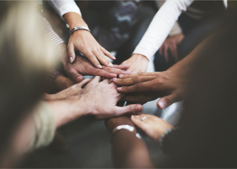 Touching hands. Hands of different people. Diversity of people. Touching others hands. Physical touch.