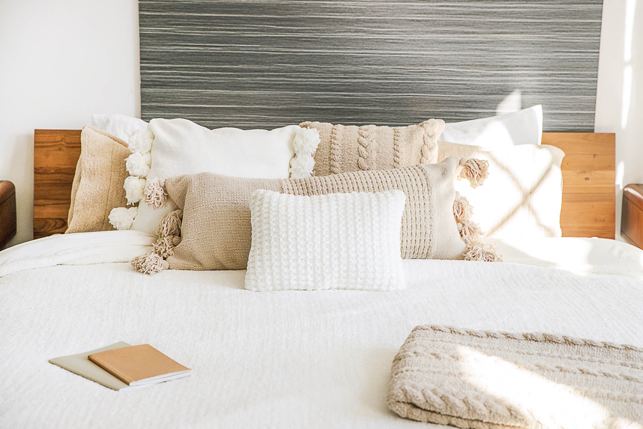 Neutral and cozy bed. White and tan bedding and pillows. White and beige bedding and pillows. Neutral cozy bed inspo. Neutral soft bedding.